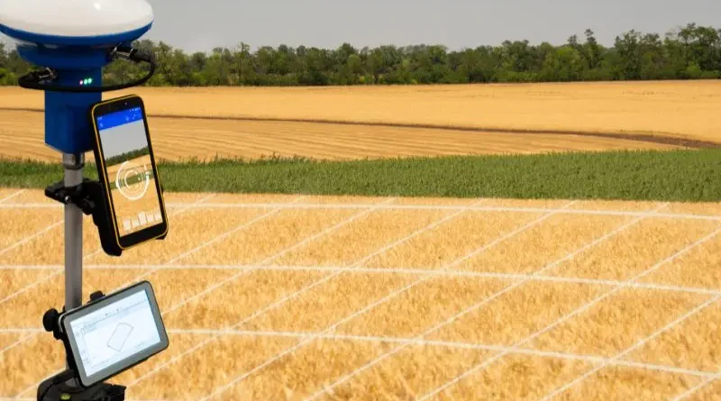 Agricultura de precisão com equipamentos modernos em campo de cultivo.